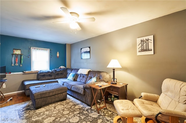 living room featuring hardwood / wood-style flooring and ceiling fan