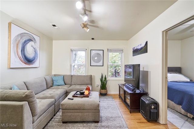 living room with light hardwood / wood-style flooring