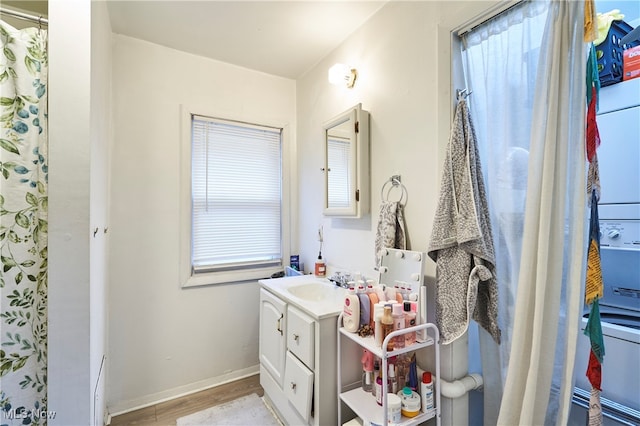 bathroom with vanity, a shower with curtain, and wood-type flooring