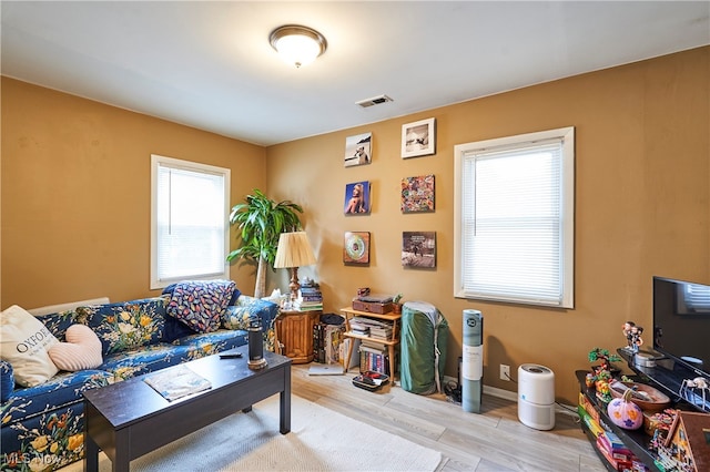 living room with light hardwood / wood-style floors