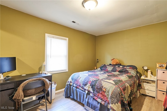 bedroom with light hardwood / wood-style floors