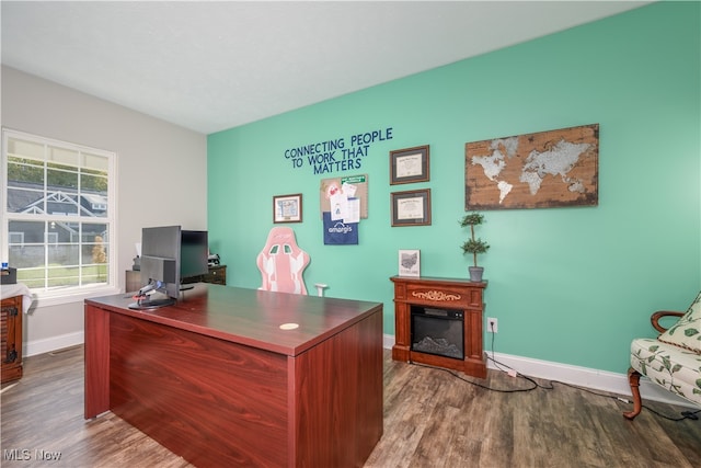 home office with hardwood / wood-style floors