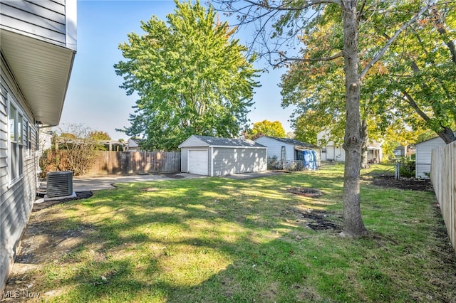 view of yard with an outbuilding and central AC unit