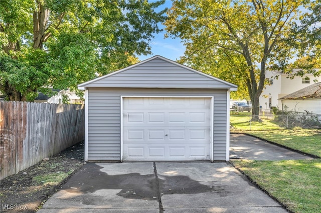 garage featuring a yard