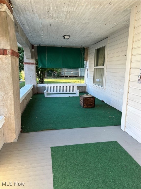 view of yard featuring covered porch