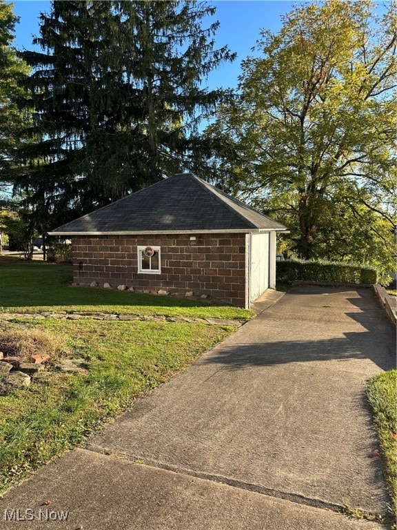 view of home's exterior with a yard