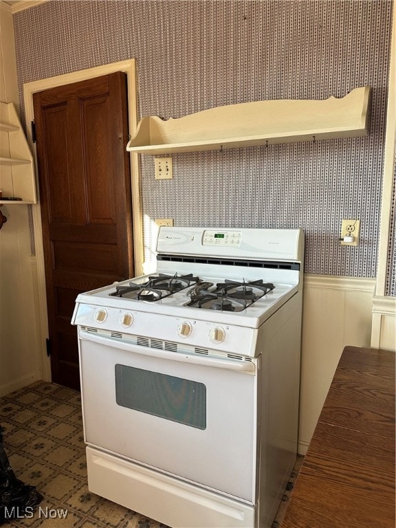 kitchen with white gas range oven