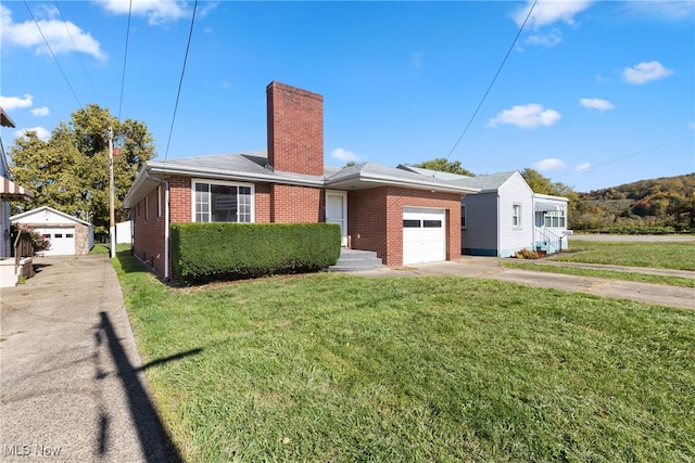 view of front facade with a front lawn and a garage