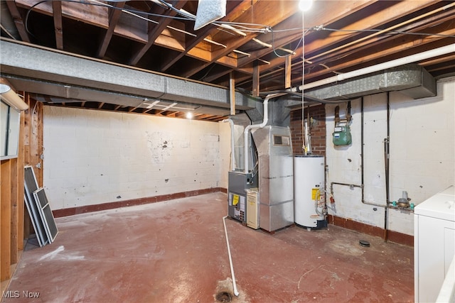 basement with washer / clothes dryer, heating unit, and water heater