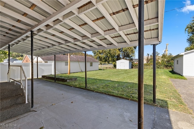 view of patio with a shed and a carport