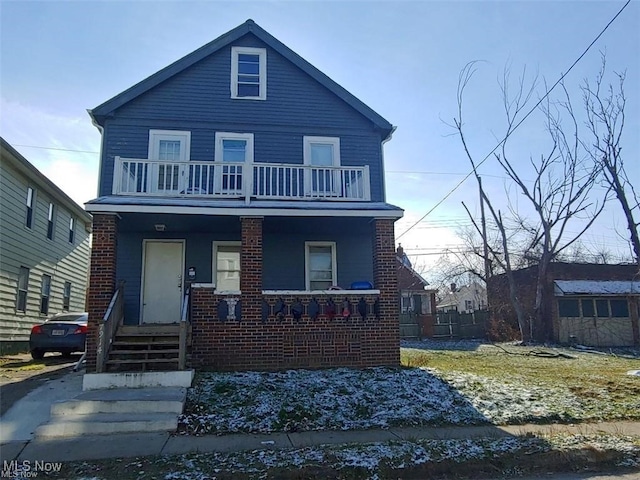 view of front of house featuring a porch and a balcony