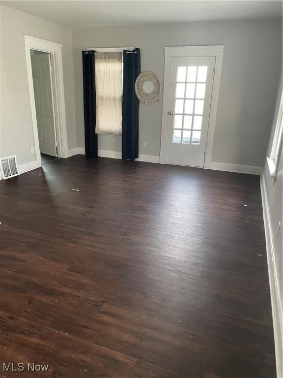 empty room featuring dark hardwood / wood-style floors