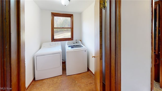 washroom with independent washer and dryer