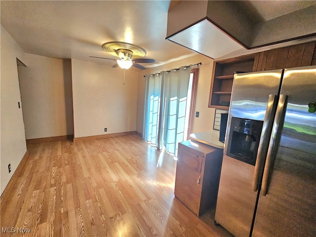 kitchen featuring stainless steel fridge, light wood-type flooring, and ceiling fan