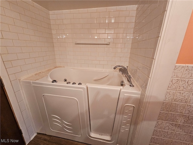 bathroom featuring a bathtub and hardwood / wood-style floors