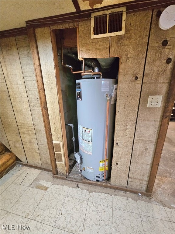 utility room with water heater