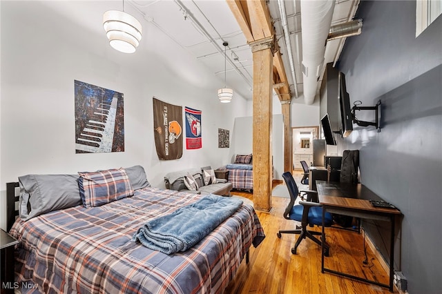 bedroom with wood-type flooring