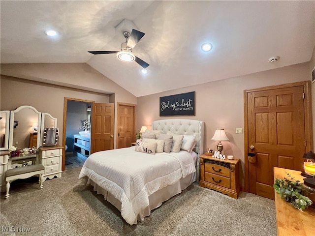 bedroom with connected bathroom, vaulted ceiling, carpet floors, and ceiling fan