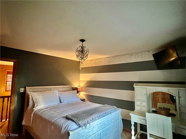 bedroom featuring an inviting chandelier