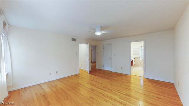 spare room featuring light hardwood / wood-style floors and ceiling fan