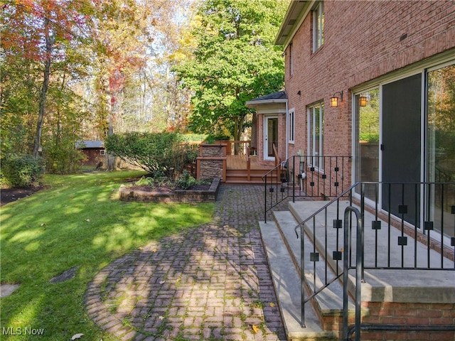 exterior space featuring a patio area and a deck