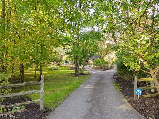 surrounding community featuring a yard