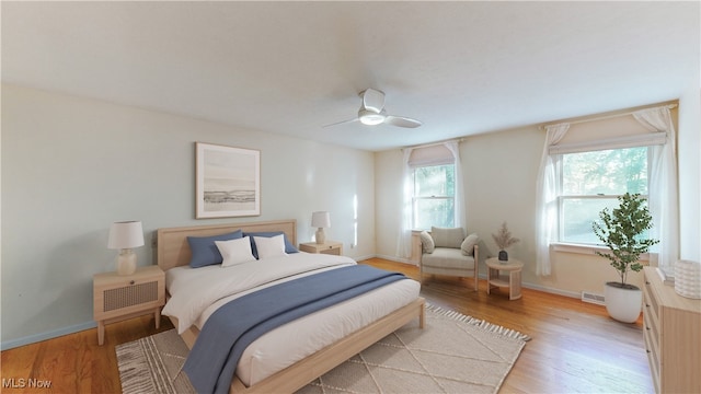 bedroom featuring light hardwood / wood-style flooring and ceiling fan