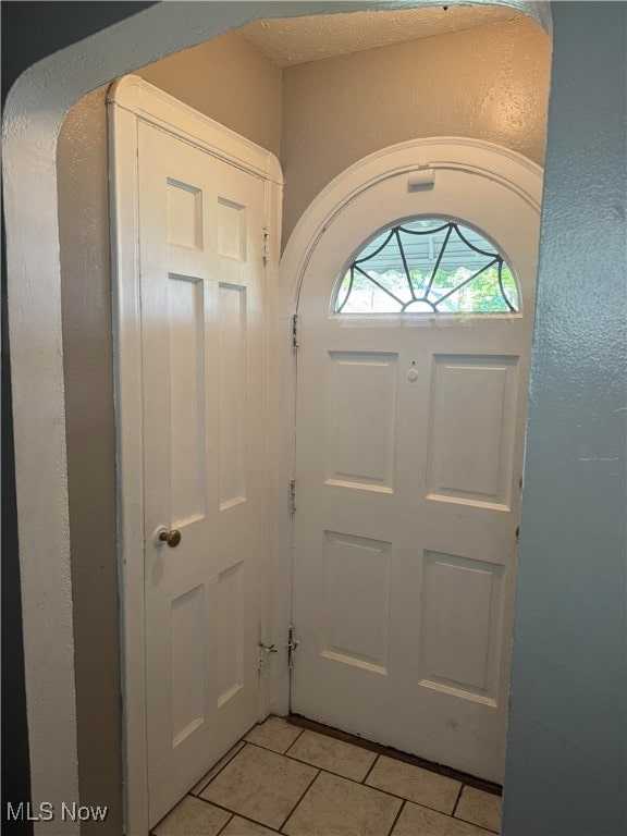 foyer with light tile patterned flooring