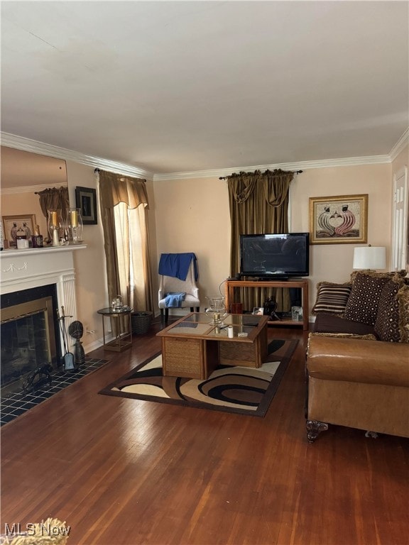 living room featuring ornamental molding and dark hardwood / wood-style flooring