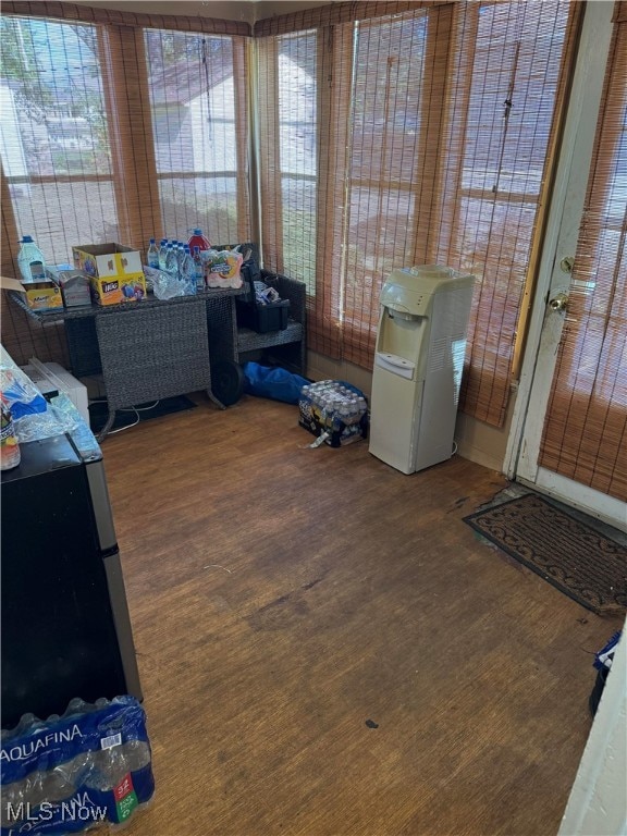 sunroom / solarium featuring a healthy amount of sunlight