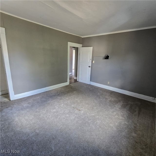 carpeted spare room with ornamental molding