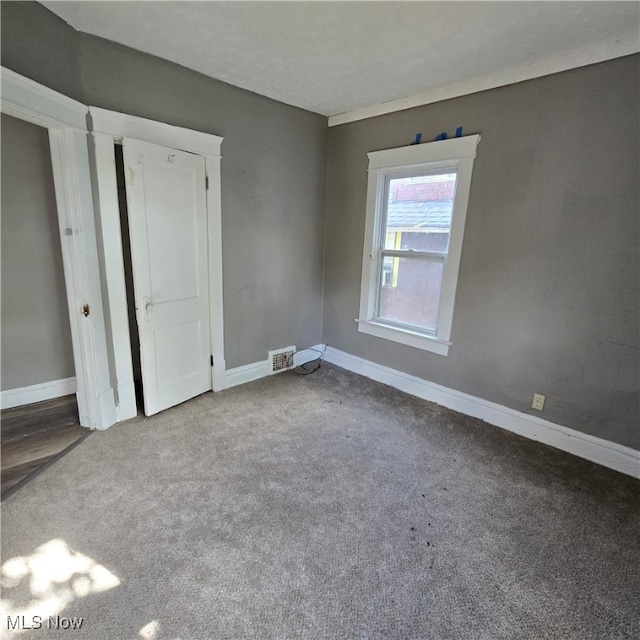 unfurnished bedroom featuring light colored carpet