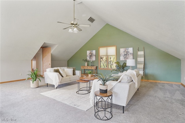 carpeted living room featuring ceiling fan and vaulted ceiling