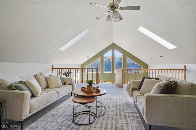 carpeted living room featuring lofted ceiling, a textured ceiling, and ceiling fan