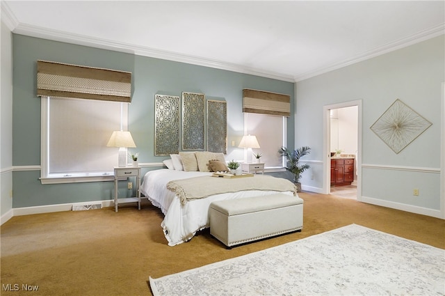 carpeted bedroom featuring ornamental molding and connected bathroom