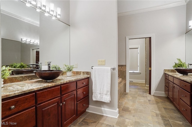 bathroom with vanity and ornamental molding