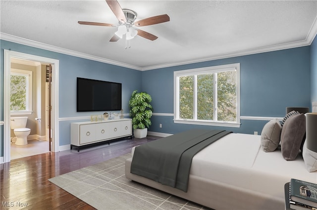 bedroom featuring ceiling fan, crown molding, a textured ceiling, and dark hardwood / wood-style flooring