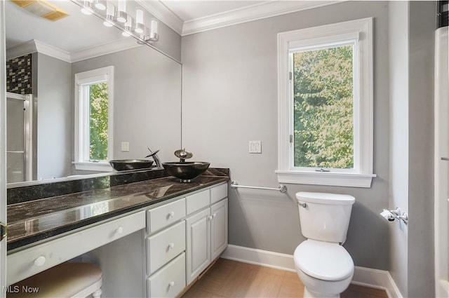 bathroom with vanity, hardwood / wood-style floors, ornamental molding, and toilet