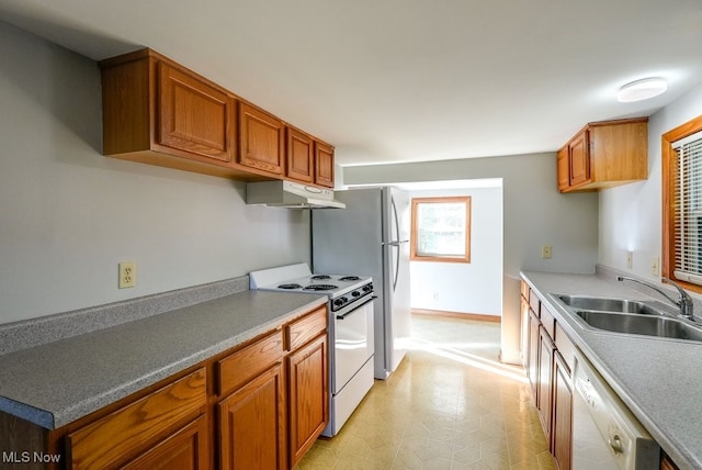 kitchen featuring sink and white appliances