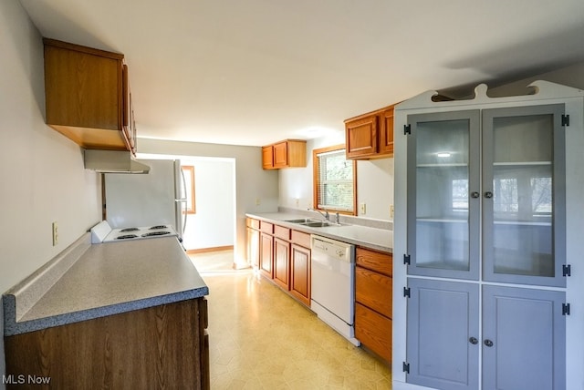 kitchen with sink and white appliances