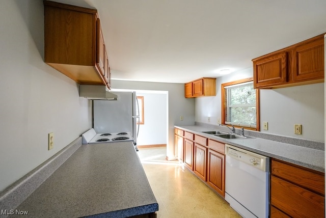 kitchen with sink and white appliances