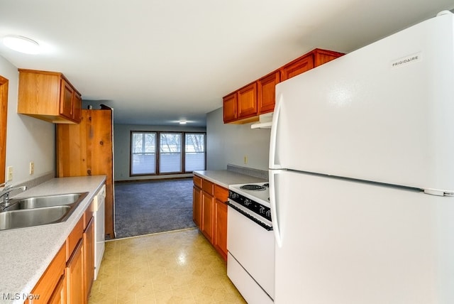 kitchen featuring sink and white appliances