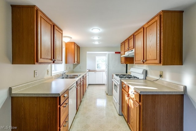 kitchen featuring sink and white appliances