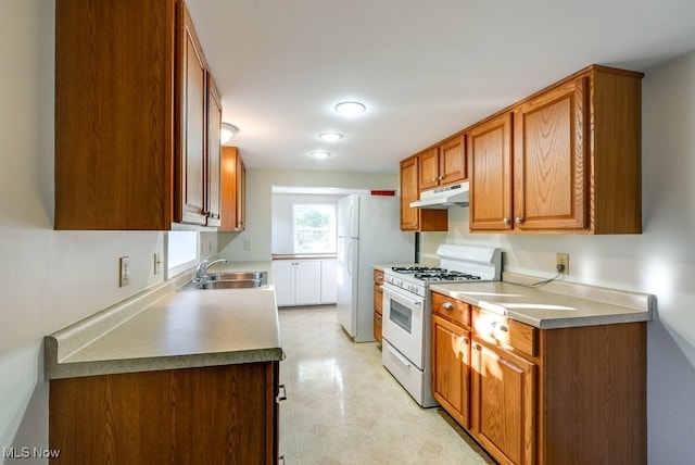 kitchen with sink and white appliances