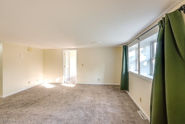 spare room with carpet floors