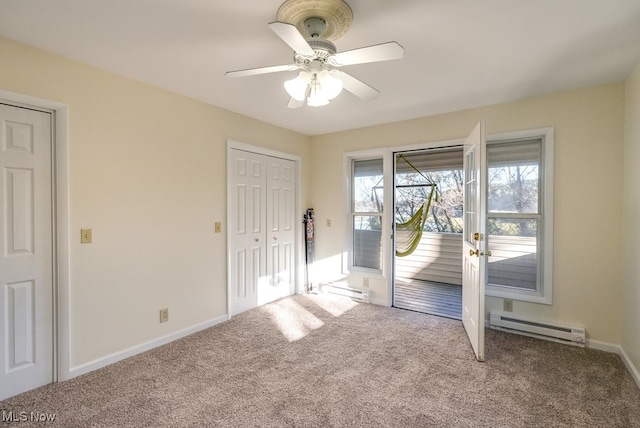 interior space featuring ceiling fan and a baseboard heating unit