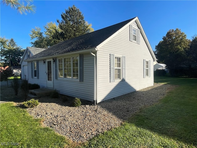 view of home's exterior with a lawn