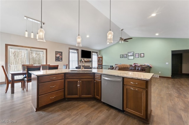 kitchen featuring dark hardwood / wood-style floors, ceiling fan, stainless steel dishwasher, and vaulted ceiling