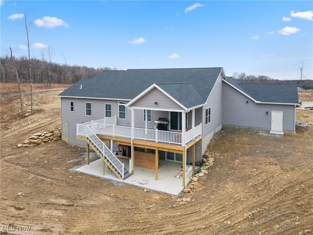 back of house with a patio and a wooden deck