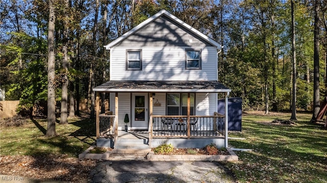 front facade featuring a front yard and a porch